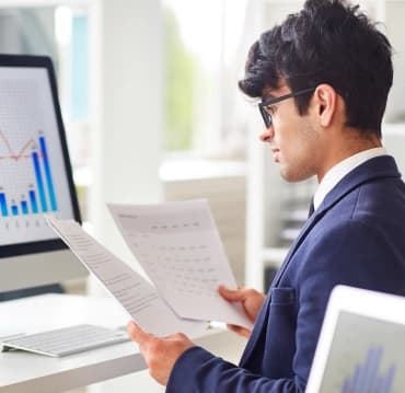 Skyllect analyst reviewing a project report