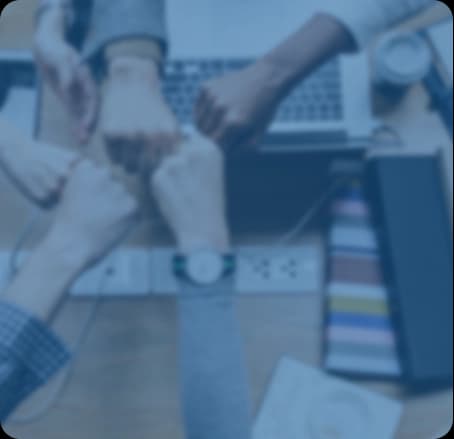 Skyllect team joining hands over a project
